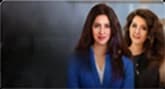 Two women in business attire during a filmed interview
